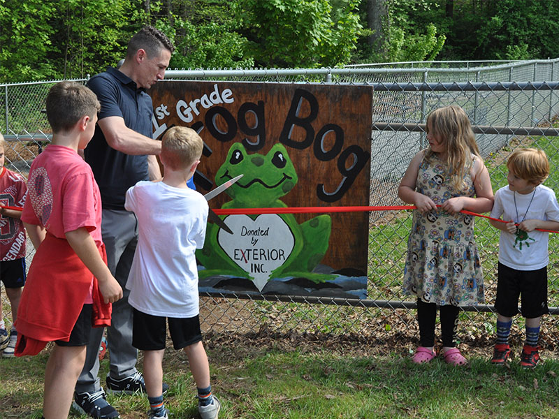 Jeremy Collis, Brayden Collis, and Joel Curtis cut the ribbon to officially open up the Frog Bog at West Fannin Elementary School. The ceremony last week marked the celebration of an ongoing project at the school.