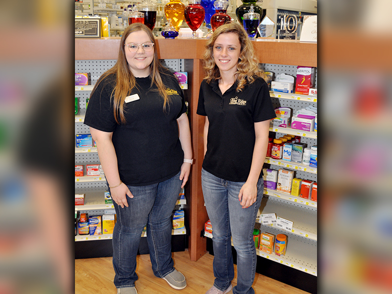 Fannin County High School seniors Hannah Ritchie, left and Ashton Davis take a break from working to smile for a photo. Ritchie and Davis help an Elderly female by going grocery shopping for her Thursday, March 26.