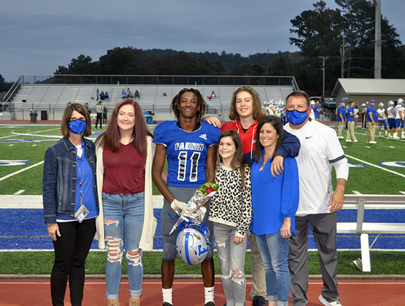 Andre Bivens was one of 15 seniors honored before the Rebels football game against Gordon Central Friday, October 9. Shown are, from left, Ivy Hyde, Bivens, Danica Padrut, Chaz Padrut, Joci Padrut and coach Chad Cheatham.