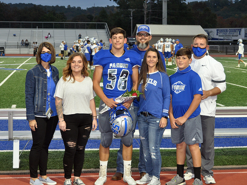 Fannin County High School honored the senior football, cheerleaders, band, cross county and sports medicine members before the Rebels game with Gordon Central Friday, October 9. Shown are, from left, sister, Chelsea Quintrell, senior, Bradyen Foster, father, Micah Foster, mother, Charlene Foster, brother, Vince Foster and coach Chad Cheatham.