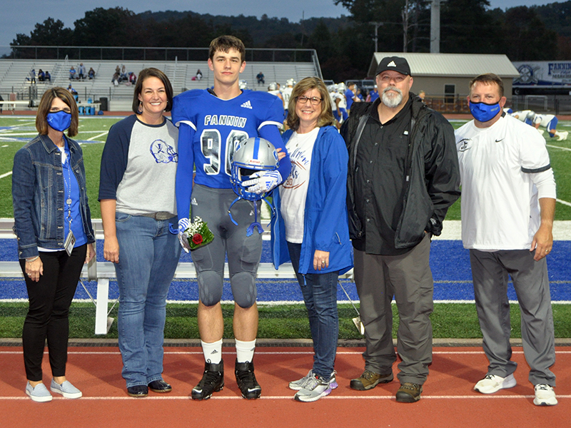 Fannin County senior Tommy Ledford was recognized with 15 other football seniors during the Rebels senior night ceremony Friday, October 9. Shown are, from left, Bridgette Butynski, Ledford, mother, Trish Ledford and father, Keith Ledford.