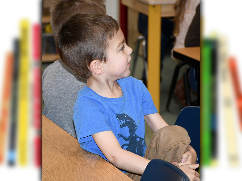 West Fannin Elementary School student Alex Marquez is on the edge of his seat as he hears another tale from Dr. Seuss during Read Across America Week Tuesday, March 2.
