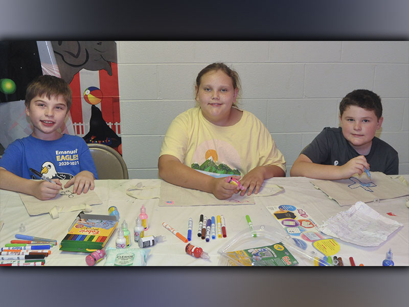 Kids created Bible covers in arts and crafts at Pleasant Hill Baptist Church’s Vacation Bible School Wednesday, June 9. Shown working on their crafts are, from left, Georgee Bonilla, Lacey Long and TJ Hughes.