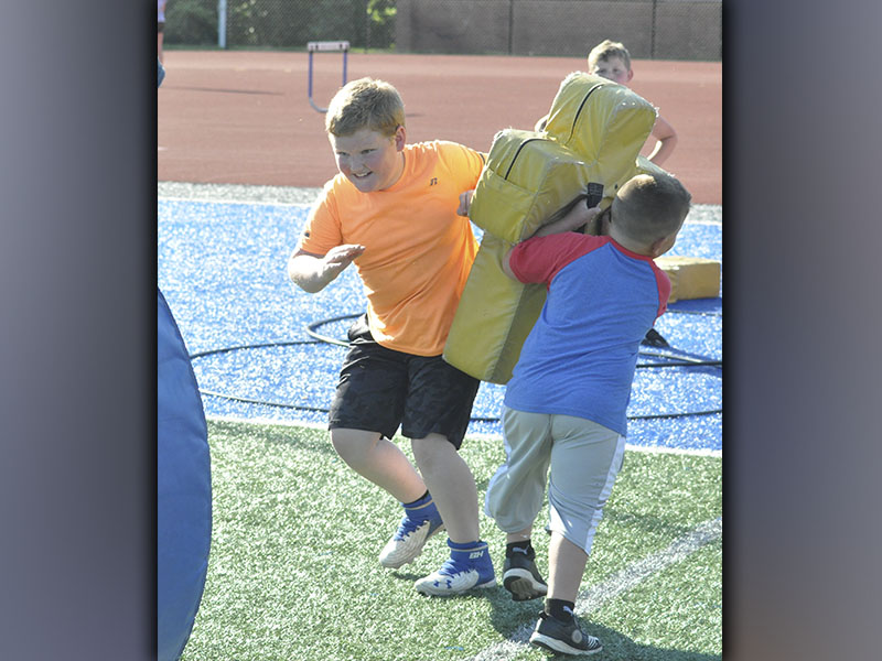 Zander Shaw sheds a tackle in a drill during football camp hosted by the Fannin County High School football team Wednesday, June 16.