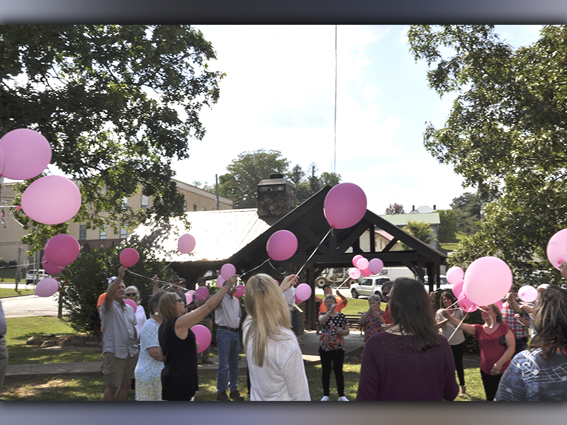 Pink balloons fill the air during a Celebration of Life ceremony in honor of Glenda Herndon in the downtown Blue Ridge park Wednesday, May 26. Herndon passed away May 19 and had worked for the City of Blue Ridge for several years.