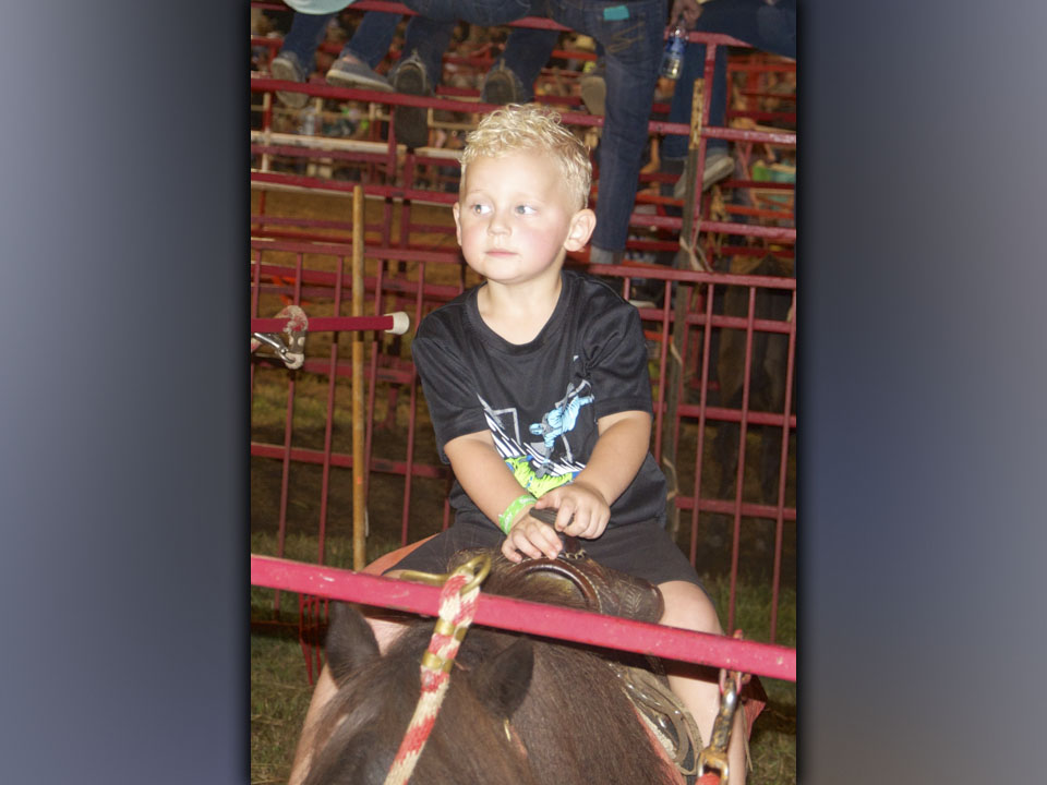 Jamison Sutton takes advantage of the pony rides during the 25th Annual Kiwanis Club of Blue Ridge and Mountain Valley Motors Rodeo Saturday, August 21.