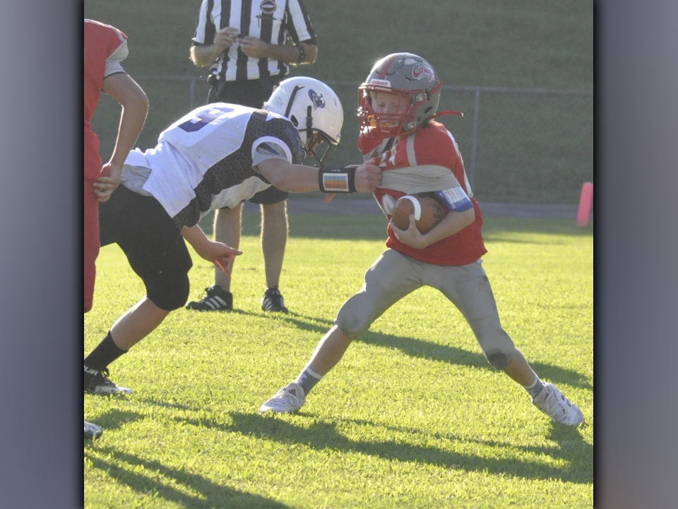 Cougar Tucker Rhodes gets an interception and shimmies past a defender during Copper Basin’s Middle School game against Bradley County Thursday, September 2.