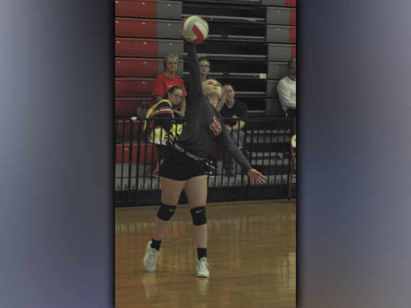 Channing Beach serves the ball during the Lady Cougars volleyball game against Meigs County Tuesday, September 7.