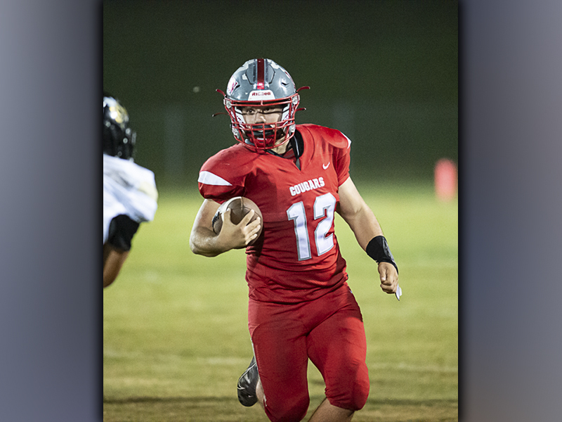 Photo by Allstar photos Sebastian Baliles (12) picks up some of his 180 rushing yards in the Cougars’ 46-25 win over Lookout Valley, Friday, October 1.