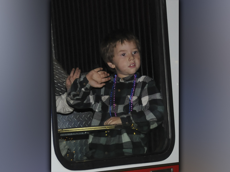 This young man was lucky enough to catch a ride on a fire truck in the Ducktown Christmas parade.