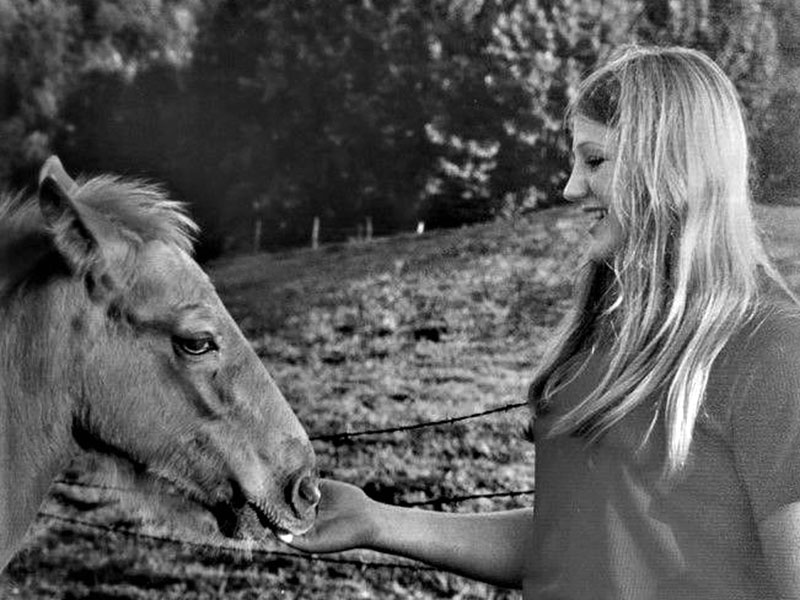 Patty Callihan and her horse on the family farm.