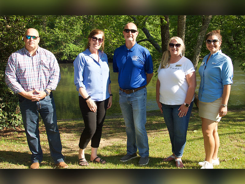 Polk and Fannin County Chambers of Commerce made an appearance at the fly fishing event to show community support. Shown, from left, are Fannin County Recreation and Chamber representative Brandon Holloway, Director of Tourism Services and Development Jode Mull, Recreation Director Eddie O’Neal, Director of Polk County Chamber of Commerce Lynne McClary and President of Fannin County Chamber of Commerce Christie Gribble.