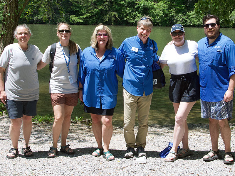 In between the upper and middle sections of the Ocoee River, TVA hosted a lunch hour where all participants could gather together to socialize and take a break from the strenuous activity. TVA representatives shown are, from left, Natural Resources Specialist Beth Cooke, Natural Resources Senior Program Manager Suzanne Fisher, Field Marketing and Communications Specialist Kelley Murray, TVA Media and Relations Specialist Scott Fielder, Communications Partner Pam Anderson and Social Media Coordinator Andrew 