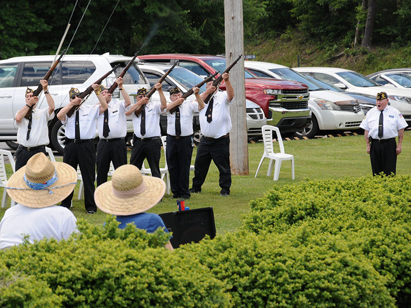 Members of the North Georgia Honor Guard fire a rifle salute during the Memorial Day service in remembrance of those who gave the supreme sacrifice. From left are, Steve Strickland, Nick Wimberley, D.R. Horton, Richard Crosley, John Grizzell, and Paul Hunter. Gerald McMillen, far right, gave commands for the salute.