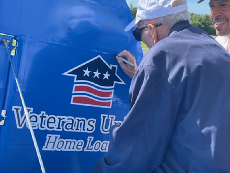 A Blue Ridge Assisted Living and Memory Care resident and WWII veteran Hoyt Campbell signed the tail of the Dream Flight plane Friday, June 10. This tail piece will be featured in a Freedom Flight museum. 
