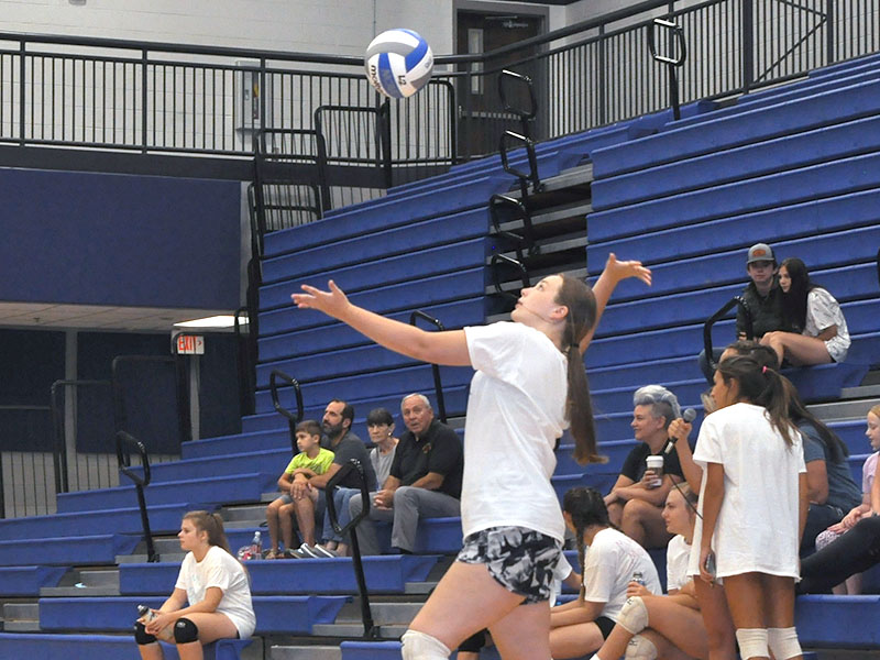 Middle School player Addy Barnes positions herself for a serve during the team tournament Thursday, July 14.