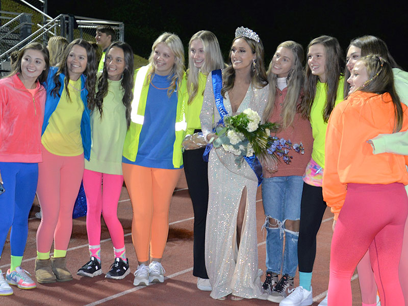 Homecoming Queen Reigan O’Neal smiles with her basketball teammates after being crowned at half time of Friday night’s football game. Pictured are, from left, Courtney Davis, Jayden Bailey, Aaleyah Rogers, Emma Holloway, Ava Queen, Homecoming Queen Reigan O’Neal, Ellie Cook, Macy Hawkins, Reese Lewis and Callie Ensley. 