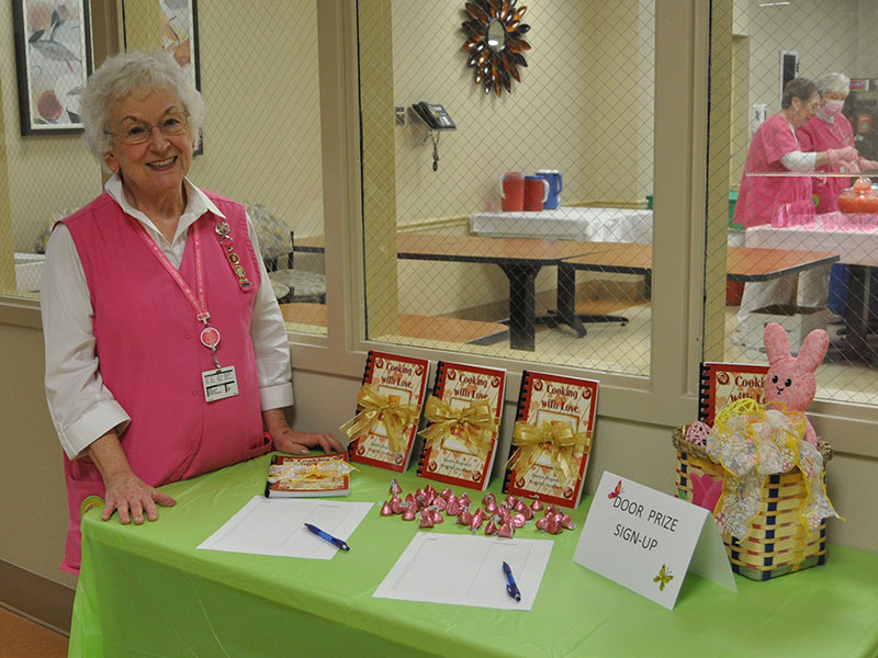 Hospital Auxiliary President Shirley Copeland made sure everyone signed up to win a door prize at the appreciation reception hosted by the Pink Ladies.