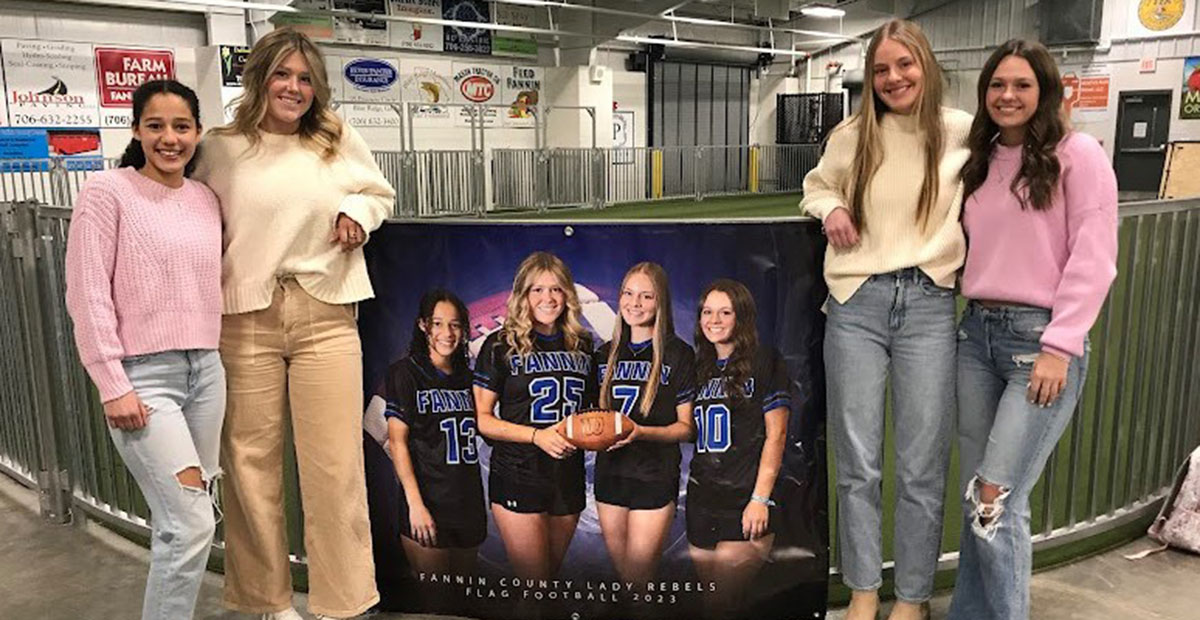 Senior players received special recognition at the Fannin County High School flag football team banquet. Shown with a poster commemorating their efforts are, from left, Stephanie Kirk, Addison Smith, Anna Beth Minear, Jayden Bailey.