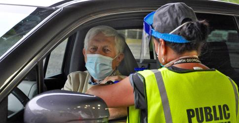 Fannin County Health Department held its annual Drive-Thru Flu Shot Clinic Thursday, September 24, which saw a large turn out. Shown getting a vaccine is Scott Macneill and administering the shot is county Nurse Manager Hollye Petty.