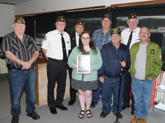Sydney Criteser, who has been with The News Observer for almost three years, was surprised Friday by a group of local veterans who came by to say thank you on her last day with the local newspaper. They presented her with a plaque and spoke many words of appreciation. Criteser is surrounded by, from left, Gerald "Chief" McMillen, Bill Stodghill, Richard Crosley, Paul Hunter, Charles Spivey, Ron Wallace, and Sonny Payne.