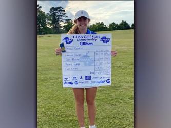 Lady Rebel golfer Lainey Panter was all smiles as she showed off the Lady Rebels scorecard after she won the AA Girls Golf State Championship. Panter finished the tournament with a blazing score of 152.