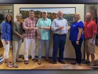 On Tuesday, May 18, Habitat for Humanity of Fannin and Gilmer Counties, along with The Open Arms Home for Children held their first annual golf tournament at Old Toccoa Farm Golf Course in Mineral Bluff. The event helped raise more than $20,000 for both charities. Shown during the check presentation are, from left, Habitat for Humanity & Golf Tournament Event Coordinator Renee Lake, Habitat for Humanity President Debbie Peterson, Old Toccoa Farm Managing Partner and President Peter Knutzen, Habitat for Huma