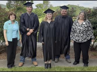 Proud GED graduates, along with a few of the people who helped them achieve their goals, celebrate together after their graduation ceremony May 18, 2021. Shown are, from left, Fannin Literacy Action Group (FLAG) Director Teresa Ross, graduates Shaun Allen, Shannon Goode and Caleb Green, and North Georgia Technical College Adult Education instructor Donna Earl. 