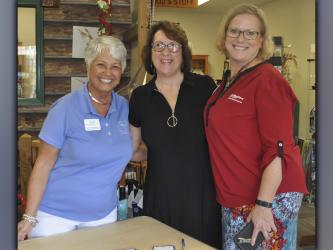 The Fannin County Chamber of Commerce held their Business After Hours event Tuesday, August 24, at the Blue Ridge Bird Seed Company, which is located at 611 East Main Street, and Danielle’s Cafe, which is located next door, provided the food and drinks. Shown greeting guests are, from left, chamber Director of Membership Services Dianne Mallernee, Brenda Morgan and Shelley Eyerly.  