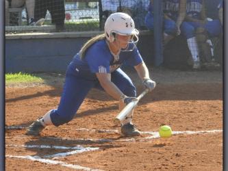 Zoe Putnam lays down a bunt during the Lady Rebels softball game against Union County Thursday, September 2.
