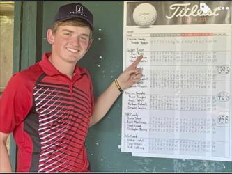 Evan Bobo is shown pointing at his region tournament score that punched his ticket to the state tournament. Bobo is set to play in Sevierville, Tennessee, October 6 through 8.