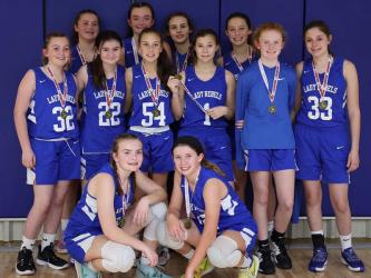 The Fannin County Middle School eighth grade Lady Rebels won the FCA Christmas Tournament by going undefeated. Shown following their title win are, from left, front,  Maggie Ledford and Izzie Jabaley; second row,  Elizabeth Powell, Kennedy Mason, Myla Rogers, Halle Walton, Albany Cole, and Noley Nations; and, back, Bridgett Allen, Reese Lewis, Lexi Gravely and Avi Ethington. Not pictured are Head Coach Tasha Anderson and Assistant Coach Morgan Helton.