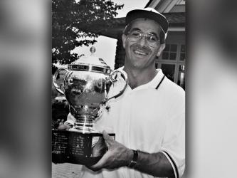Chuck Jabaley proudly displays his trophy as the 1994 Tennessee Open champ.