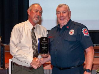 Fannin County Emergency Management Agency Director Robert Graham is presented the James H. Creel Jr., EMS Pioneer of the Year Award by David Newton, retired director of t he Georgia Office of EMS and Trauma
