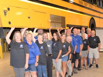 Several of Fannin County’s school bus drivers took part in the open house for the school system’s new Transportation Facility last week. They had a good time “holding up” a bus on one of the new lifts. Shown from left are; Melissa Beaver, Dana Imler, Billy Standridge, Frances Newberry, Glenn Lewis, Darrel Davis, Pepper McConnell, Lisa Cheatham, Robin Searcy, Sam Banks, Jeff Johnstone, Jeff Thomas, Julie Johnson, Gary Bailey, Tom Mills, and Junior Dillinger.