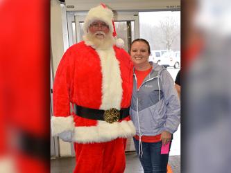 Shop With a Cop board member Dawn Cochran welcomed Santa Claus to Walmart Saturday to help children make their Christmas decisions.