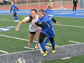 Lady Rebel Emma Richardson battles for the ball in recent Fannin soccer action. 