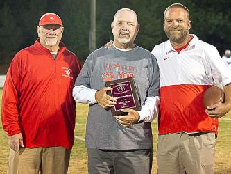 Former Copper Basin head football coach Mark Stone, center, was honored as a Legend of the Game Friday night. He is shown with John Spargo, left, of the school’s alumni association, and current head coach Chad Grabowski.