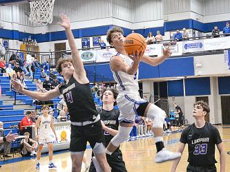 Fannin County’s Ben Bloch scored eight points for the Fannin County Rebels as they spoiled Rockmart’s perfect 12-0 season mark Friday, January 5, in the Rebel gym. Bloch is shown here in previous action for the Rebels.