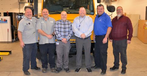It’s all about family at the Fannin County School System Transportation Department. Retiring director Robert Ensley is shown with the garage staff portion of that family as he worked through the last days of his 45 in Fannin schools last week. Shown enjoying a laugh are, from left, Tom Cook, Rodney Ensley, Chris Drury, Robert Ensley, Denver Foster, and Tommy Jourdan.