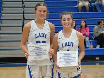 Lady Rebels Macy Hawkins, left, and Courtney Davis received All Tournament honors in the Fannin County High School Christmas tournament. Rebels Ben Bloch and Cole Gribble were named from the Rebels.