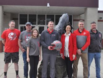 Copper Basin High School’s new head football coach Brett Graves, holding helmet, is pictured with, from left, Athletic Director Jeff Grimes, his father, Perry Graves, daughter, Callie  Graves, Principal Holly Smith, Assistant Athletic Director Kevin Smith, and middle school football coach Rusty Boggs. 