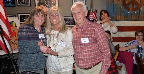 Sherry (center) and Bill Echelberger were recognized as Snack in a Backpack’s Community Champions  at the annual Champions for Children event Thursday, February 29, at Fightingtown Tavern. For a description of their contributions, please see page A10. Jeannie May, Snack chairwoman, presented the award.