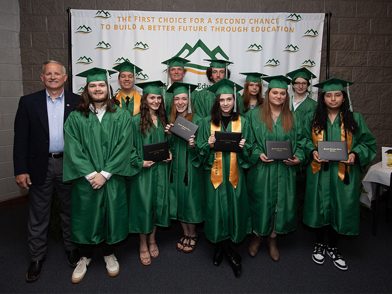 Mountain Education Students earned their high school diplomas and celebrated at graduation. Taking part in the event were, from left, front, Xander Parks, Kelsey Greene, Shayna Bolmon, Aislinn Peel, Alayha Spriggs, and Vanesa Medrano-Roman; and, back, State Representative Johnny Chastain, Tristin Pace, Cameron Goodwin, Darryl Carpenter, Kaitlyn Murray, and Hunter Mark.