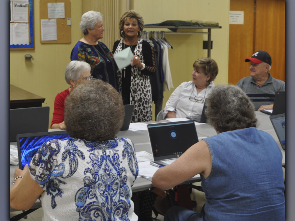 Dorothy Jeanette Callihan, left, gives Vicki Ledford a thank you card from the very appreciative group of seniors who completed their computer training at Copper Basin Community Center training Friday, August 13. 