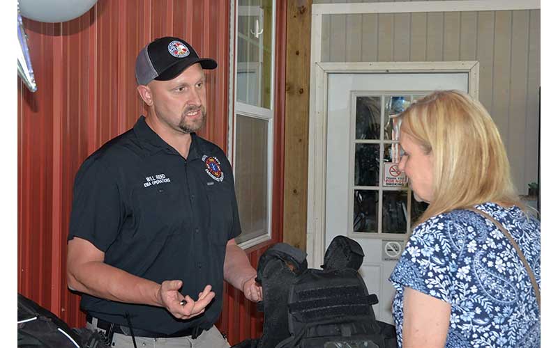 News Observer photo/Mollie Morrow - Will Reed with the Fannin County Emergency Management Agency speaks of some needs during Impact100 Fannin's Non-Profit Fair and Big Reveal June 9.