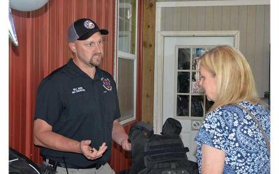News Observer photo/Mollie Morrow - Will Reed with the Fannin County Emergency Management Agency speaks of some needs during Impact100 Fannin's Non-Profit Fair and Big Reveal June 9.