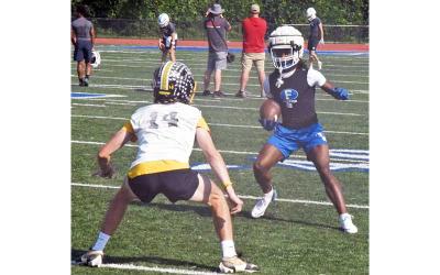 News Observer photo/Jason Queen - Fannin County Rebel Ryan Preston (right) attempts to get around his Murphy opponent in 7-on-7 action at the school's stadium June 11.