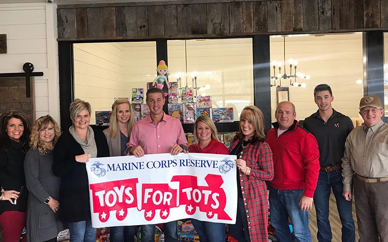 Nathan Fitts &amp; Team with ReMax Realty won first place in the last Marine Toys for Tots challenge sponsored by Tracie Griffith with First Community Mortgage Group and Mountain Valley Community Bank. Shown, from left, are: Kristy Baugh, Griffith, Stacy Lewis, Sara Seastone, Nathan Fitts, Ashlee Picklesimmer, Kimberly Baugh, Ritchie Panter, Grant Fitts and Jim Brumbalow.