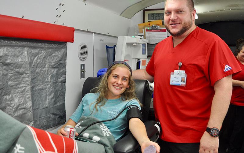 Fannin County High School student Teagan Cioffi relaxes after donating blood at Blood Assurance’s blood drive on the school’s campus Friday, September 20. She is shown with Donor Care Specialist Chad Taylor. The blood drive was sponsored by the high school.